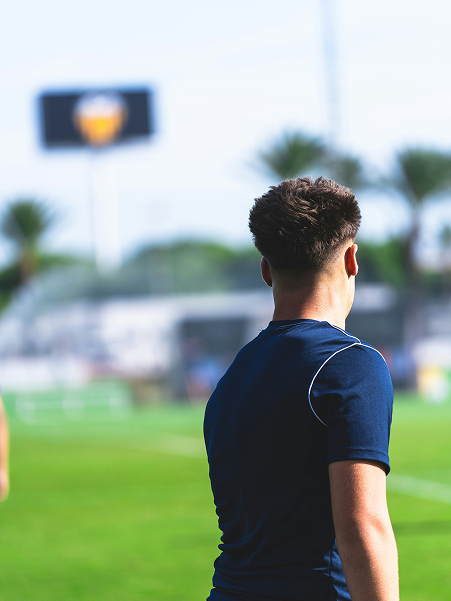 Young players training with hurdles