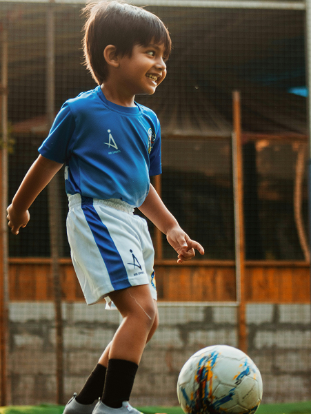 Young players training with hurdles