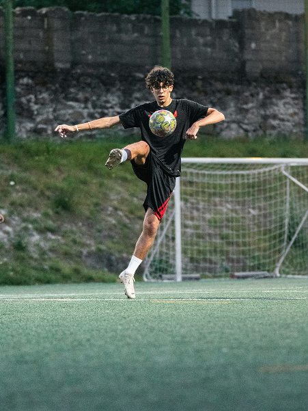 Young players training with hurdles