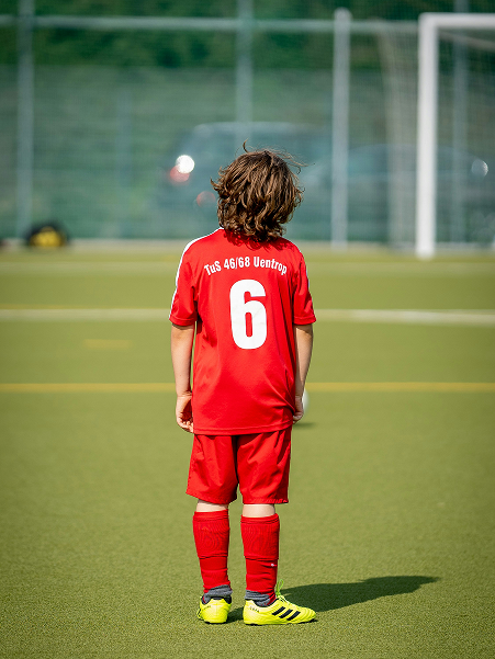 Young players training with hurdles